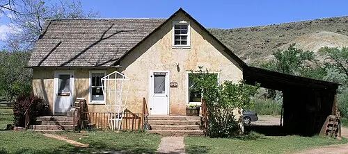 The white 1908 Gifford farmhouse in the Fruita historic district of Capitol Reef National Park, where pies and preserves are sold.