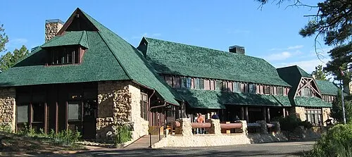 The 1925 Bryce Canyon Lodge, a sandstone and log structure designed by Gilbert Stanley Underwood, set among ponderosa pines.