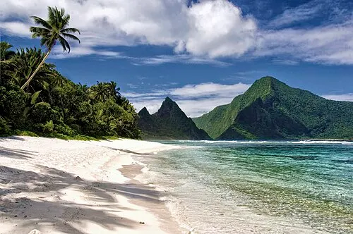 The white-sand beach and calm fringing-reef lagoon of the Ofu unit in the Manu'a islands.