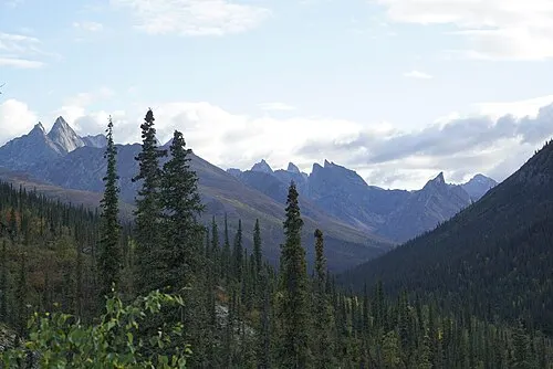 Distant view of the granite spires of the Arrigetch Peaks in the central Brooks Range.