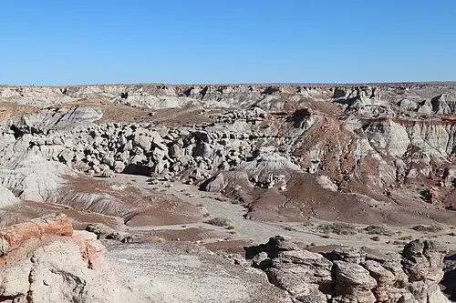 Banded blue, purple, and gray badland hills of the Chinle Formation at Blue Mesa overlook, Petrified Forest National Park.