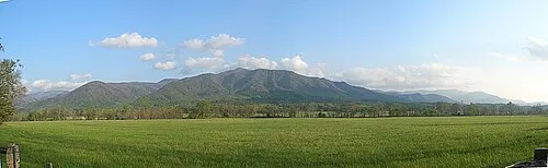 Panoramic view of Cades Cove valley with the Smokies as backdrop, ringed by the 11-mile loop road.