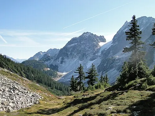 Open alpine meadow and surrounding peaks at Cascade Pass, a trans-mountain trade corridor in North Cascades National Park.
