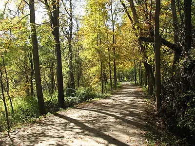 A section of the Ohio and Erie Canal beside the Towpath Trail in October fall color at Cuyahoga Valley National Park.