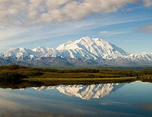 Denali, the highest peak in North America, reflected in Wonder Lake at Mile 85 of the Denali Park Road.