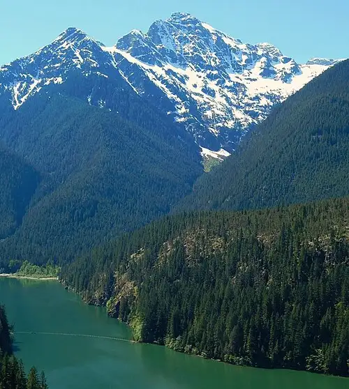 Turquoise Diablo Lake below Colonial Peak in North Cascades National Park, the glacial rock-flour color lit by the sun.