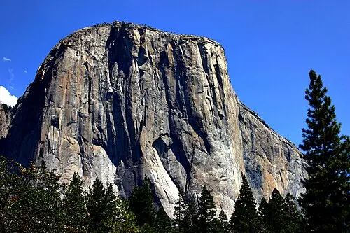 The roughly 3,000-foot vertical granite face of El Capitan above the Yosemite Valley floor.