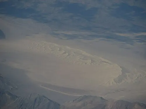 The tall steep face of the Eureka Dunes rising from the Eureka Valley floor.
