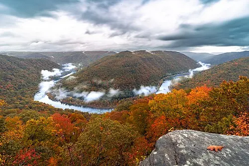 Evening mist over a horseshoe bend of the New River seen from the Grandview rim.