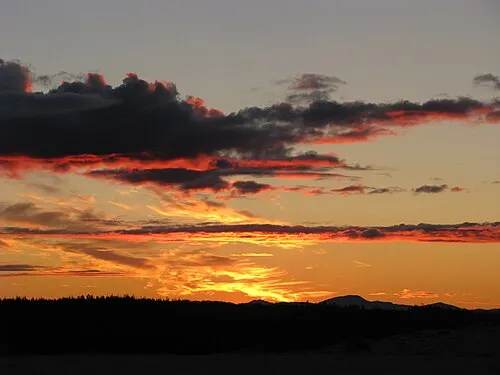 Sunset rakes across the ripples of the Great Kobuk Sand Dunes, the largest active Arctic dune field in North America.