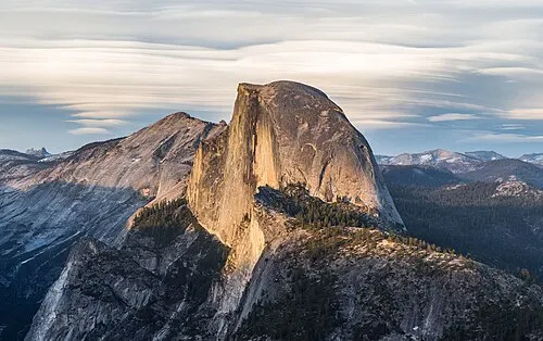 Half Dome rising to 8,839 feet, its sheared northwest face seen from Glacier Point.