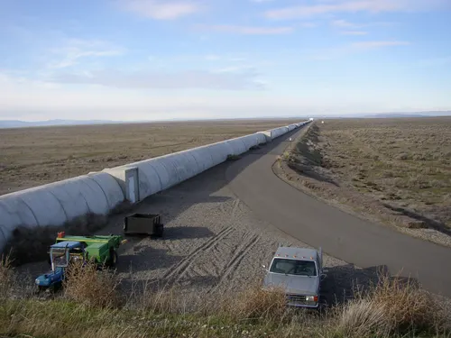 The northern interferometer arm of LIGO Hanford running into the Wahluke Slope shrub-steppe of the Hanford Reach.