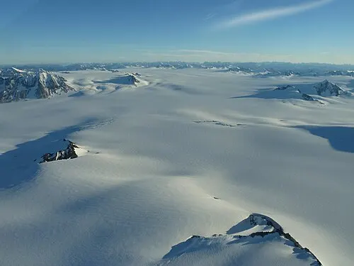 Aerial view of the Harding Icefield, an expanse of ice broken by rock peaks atop the Kenai Mountains.