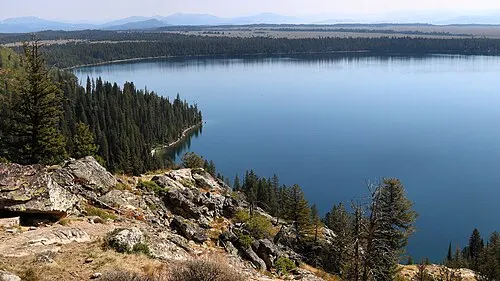 Jenny Lake with the Cathedral Group of the Teton Range rising directly behind the far shore.