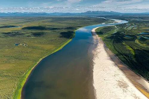 An oxbow of the Kobuk Wild and Scenic River winding through boreal forest and tundra inside Kobuk Valley National Park.