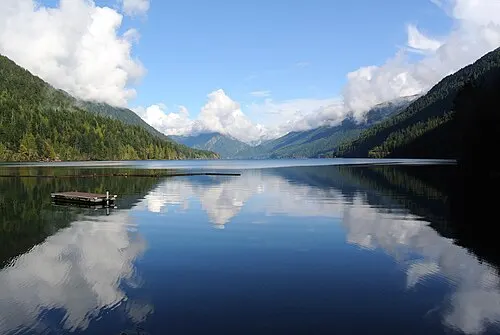 Clear glacial water of Lake Crescent ringed by forested ridges.