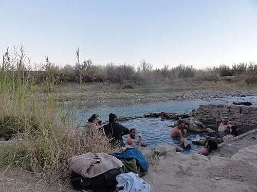The stone foundation of the old Langford bathhouse holding warm mineral water at the edge of the Rio Grande, Big Bend National Park.