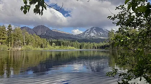 Manzanita Lake at the northwest entrance with Lassen Peak reflected in calm water.