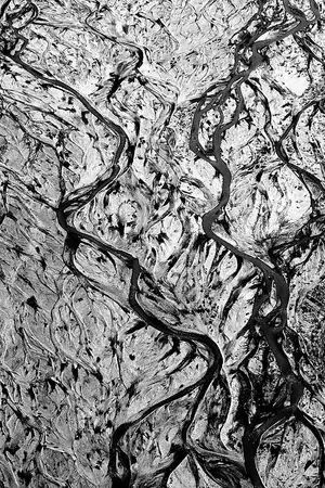Aerial view of the McKinley River spreading into braided meltwater channels below the Muldrow Glacier.