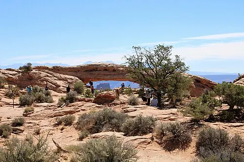 Mesa Arch on the canyon rim at Island in the Sky, Canyonlands National Park, framing the drop to the White Rim country below.