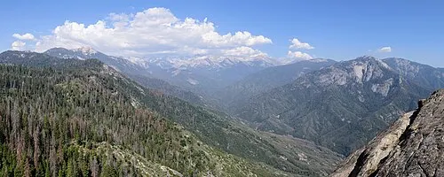 Panorama from the Moro Rock granite dome looking out over the forested Sierra Nevada in Sequoia National Park.