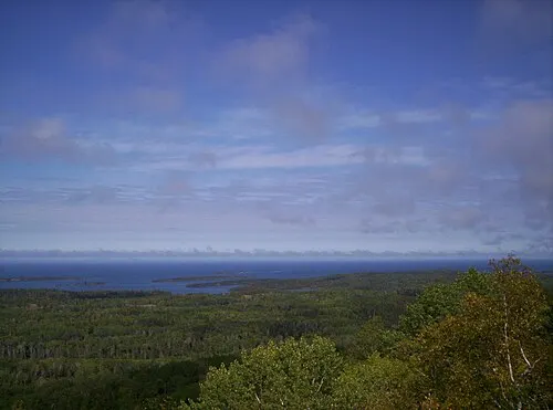 View from the top of Mount Franklin on Isle Royale, looking out over forested ridges and Lake Superior.