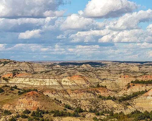 Eroded badlands buttes of Painted Canyon seen from the I-94 rim overlook at Theodore Roosevelt National Park, North Dakota.