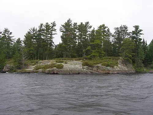 Open water and rocky boreal-forest shoreline of Rainy Lake, Voyageurs National Park, Minnesota.