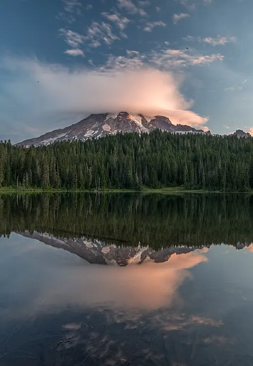 Mount Rainier's south face mirrored in the still water of Reflection Lakes on Stevens Canyon Road.