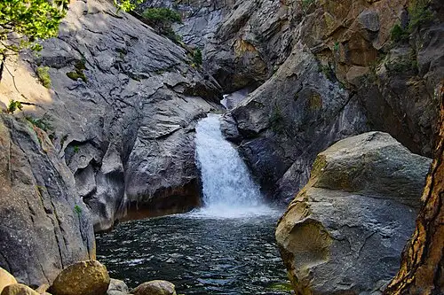 Roaring River Falls, a 40-foot waterfall pouring through a granite chute in Cedar Grove, Kings Canyon National Park.