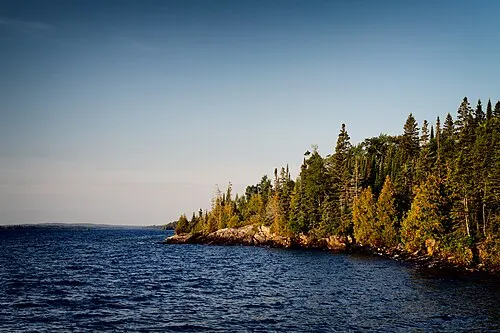 Exposed basalt shoreline of Isle Royale meeting Lake Superior along the route to Scoville Point.
