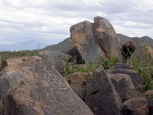 Hohokam petroglyphs carved into desert-varnished boulders at Signal Hill in the Tucson Mountain District.