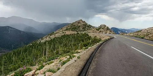 Trail Ridge Road crossing alpine tundra above treeline, the highest continuously paved through-road in the United States.