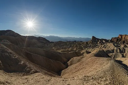 Eroded golden mudstone badlands of the Furnace Creek Formation seen from Zabriskie Point.