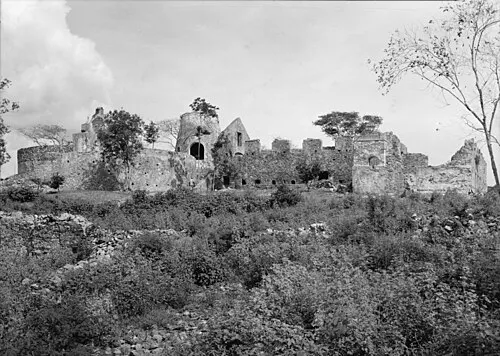 Stone windmill tower and ruins of the Annaberg sugar plantation on a hillside above the North Shore.