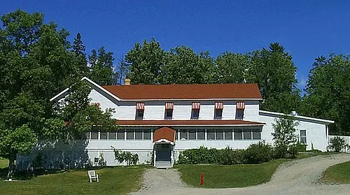 The white wood-frame Kettle Falls Hotel, a 1910s building reachable only by boat in Voyageurs National Park.