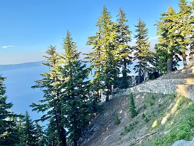 The stone Sinnott Memorial observation station built into the caldera wall below Rim Village at Crater Lake.
