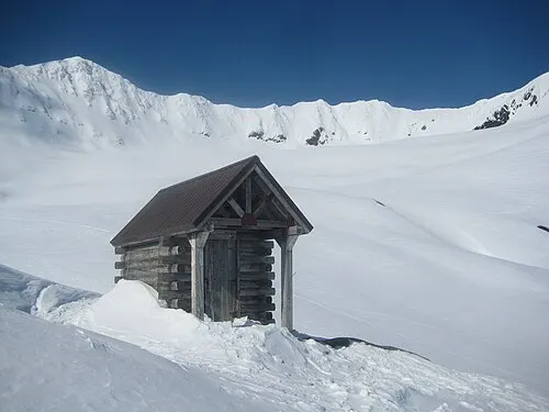 A coastal park shelter structure in Kenai Fjords National Park, reachable only by boat.