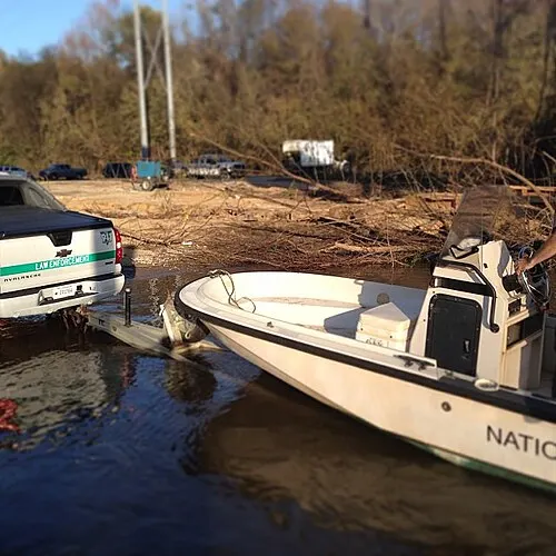 Park rangers launch patrol boats at the 601 landing on the Congaree River, a regional stand-in for the Columbia lodging base.