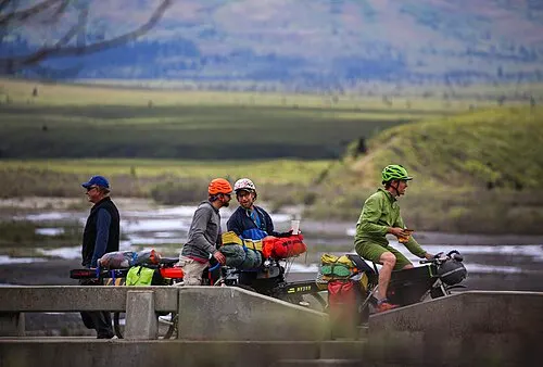 Cyclists crossing the Savage River bridge at Mile 15, the farthest point private vehicles can drive in Denali.