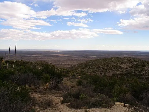 Desert view from the Carlsbad Caverns visitor center toward Whites City and the gateway approach road.