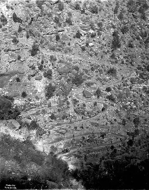 Hikers descending the switchbacks of the Bright Angel Trail below the South Rim.