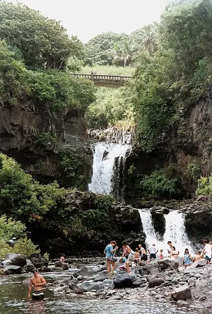 Swimmers in a coastal pool in the Kīpahulu District near the ocean campground at Haleakalā National Park.