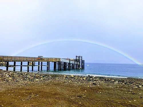 The pier at Scorpion Anchorage on Santa Cruz Island viewed from shore below the Cavern Point bluff.