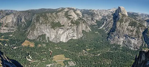 The view down on Yosemite Valley, Half Dome, and the high country from the Glacier Point overlook, 3,214 feet above the Valley floor.