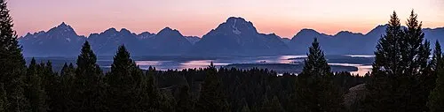 The view from the Signal Mountain summit road across Jackson Hole to the full Teton Range, Jackson Lake, and the Snake River oxbows.