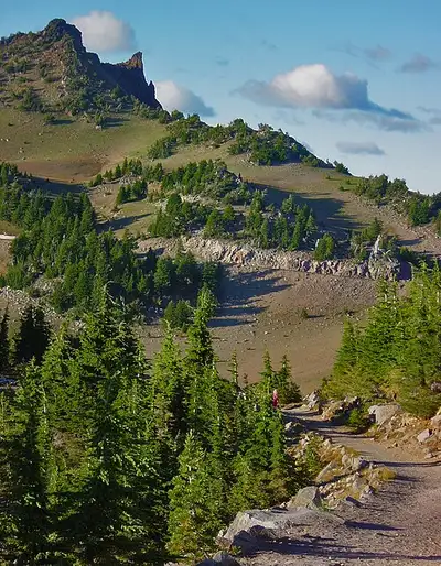The Watchman Trail switchbacking up the west rim above Crater Lake and Wizard Island.