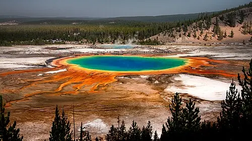 Elevated view of Grand Prismatic Spring from the Fairy Falls Trail overlook, showing the full ring of colors.