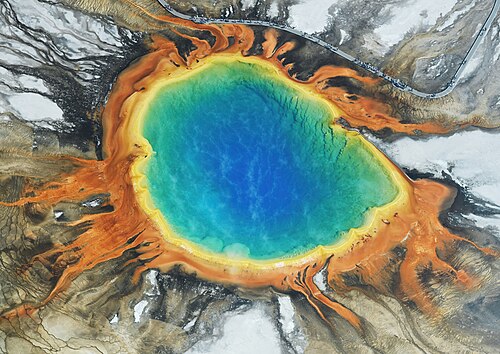 Aerial view of Grand Prismatic Spring from the south showing concentric rings of color