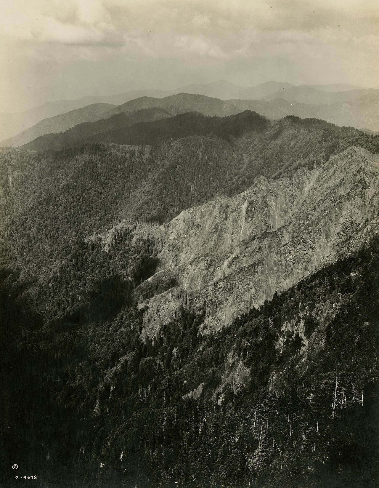 Black-and-white 1930s photograph by George Masa looking out from The Jump Off across the Smokies ridge stack